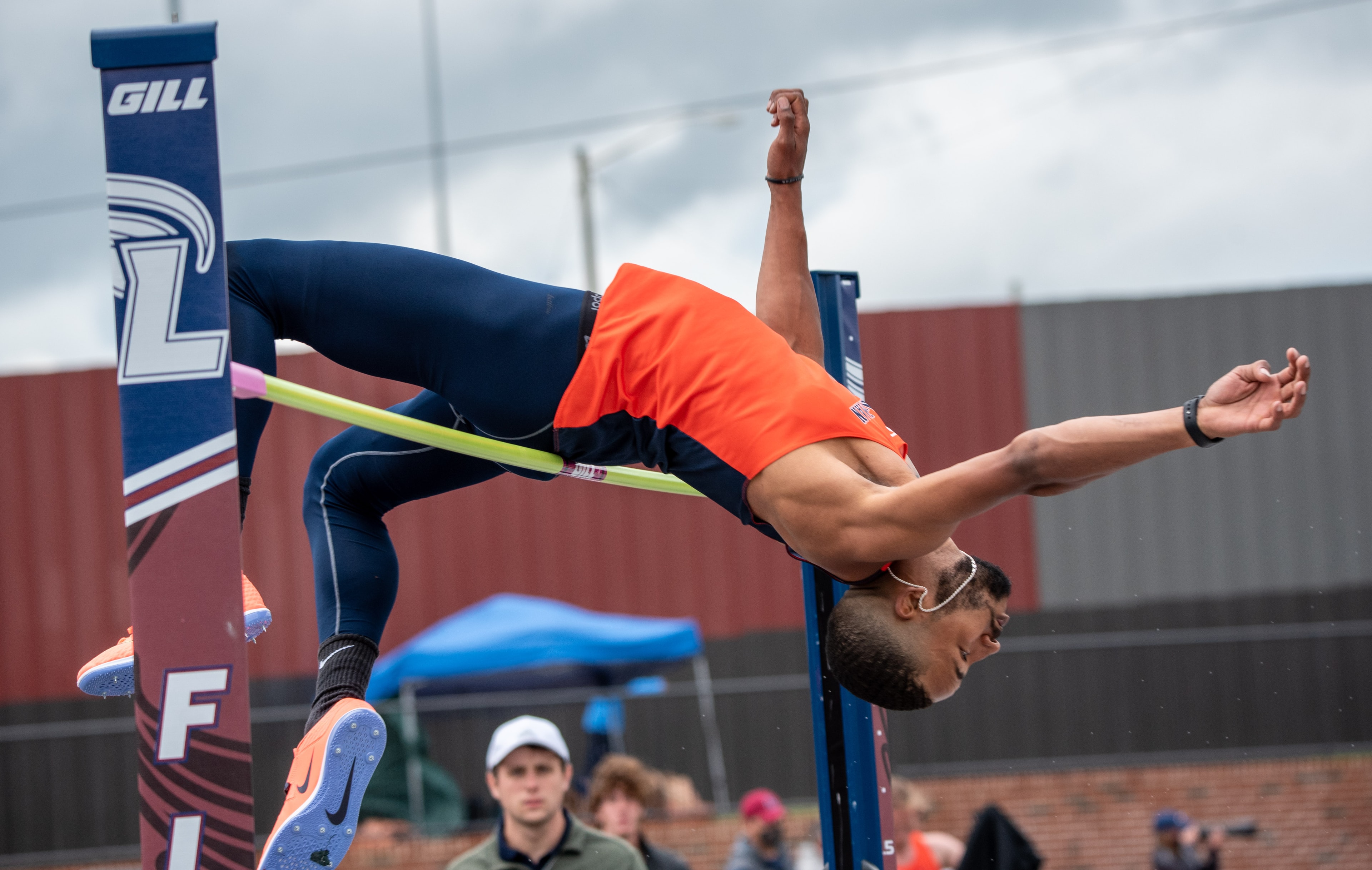 Athlete arching over the high jump bar