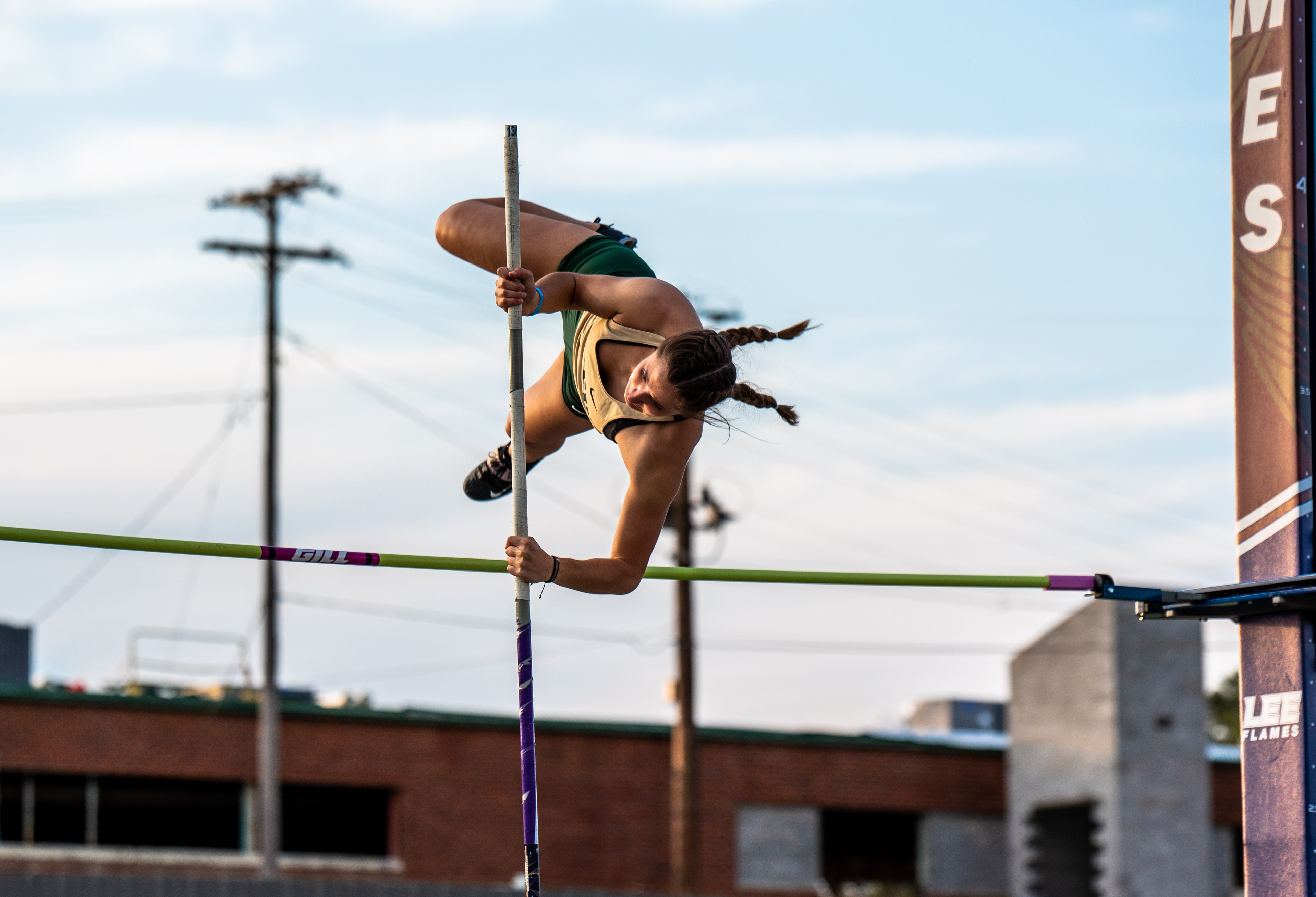 Athlete arching over the pole vault bar